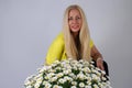 Woman with oxeye daisy flowers