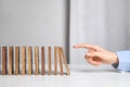 Woman with wooden dominoes at white table, closeup Royalty Free Stock Photo