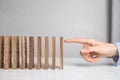 Woman with wooden dominoes at white table, closeup Royalty Free Stock Photo