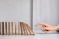 Woman with wooden dominoes at white table, closeup Royalty Free Stock Photo