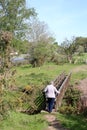 Woman on wooden footbridge, Lancashire countryside Royalty Free Stock Photo