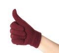 Woman in woolen glove showing thumb up gesture on white background, closeup. Winter clothes Royalty Free Stock Photo