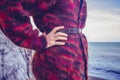 Woman in woolen jumper on the beach Royalty Free Stock Photo