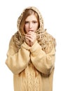 Woman in woollen comforter warming frozen hands