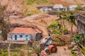 A woman at work in front of a simple house in the mountains of Santiago Island, Cape Verde, Africa