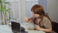 A woman at work in the office dines with bamboo chopsticks