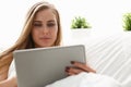 Woman work winh laptop stay in bed early morning Royalty Free Stock Photo