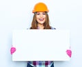 Woman worker builder hold big sign board against white backgrou Royalty Free Stock Photo