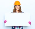 Woman worker builder hold big sign board against white backgrou Royalty Free Stock Photo