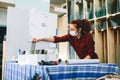 Woman worker packing products for shipment