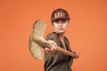 woman worker in protective helmet and boilersuit hold shovel on orange background, industry Royalty Free Stock Photo