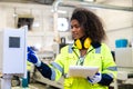 woman worker work control operate CNC wood milling machine in wood furniture workshop. technician staff women working with modern Royalty Free Stock Photo