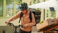 Woman working as food delivery courier picking up vegetables