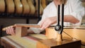 Woman Working As Lute Maker Tuning Guitar With Diapason Royalty Free Stock Photo