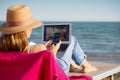 Woman working on the beach Royalty Free Stock Photo