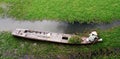 A woman working on the boat in Mekong Delta, Vietnam Royalty Free Stock Photo