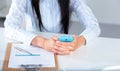 Woman working on celphone, sitting at the desk Royalty Free Stock Photo