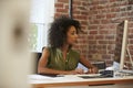 Woman Working At Computer In Contemporary Office Royalty Free Stock Photo