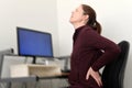 Woman Working on Computer Suffering from Back Pain Royalty Free Stock Photo