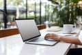 Woman working on computer in modern office, close up. Woman hands typing on keyboard of laptop, online shopping detail Royalty Free Stock Photo