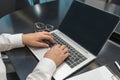 Woman working on computer in office. Hands on keyboard Royalty Free Stock Photo