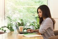 Woman working on computer, using technology outdoors