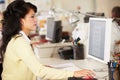 Woman Working At Desk In Busy Creative Office Royalty Free Stock Photo