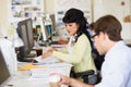 Woman Working At Desk In Busy Creative Office Royalty Free Stock Photo