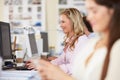 Woman Working At Desk In Busy Creative Office Royalty Free Stock Photo