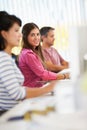 Woman Working At Desk In Busy Creative Office Royalty Free Stock Photo