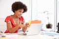 Woman Working At Desk In Design Studio