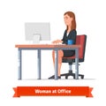 Woman working on a desktop at the office table