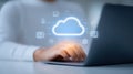 Woman working efficiently on laptop with cloud computing icon, seamless data access and storage Royalty Free Stock Photo