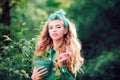 Woman working in green beautiful garden. Woman holding flower pot. Royalty Free Stock Photo