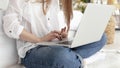 woman working with her laptop her lap. High quality photo Royalty Free Stock Photo