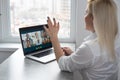 Woman Working From Home Having Group Videoconference On Laptop