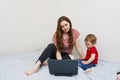 Woman working from home with her baby on lap Royalty Free Stock Photo