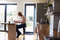 Woman Working From Home On Laptop In Modern Apartment Royalty Free Stock Photo