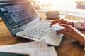 Woman working in home office, close up of hands on keyboard. Businesswoman typing on laptop at workplace Royalty Free Stock Photo