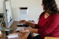 Woman working from home, using computer in home office Royalty Free Stock Photo