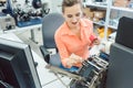 Woman working on label printing machine Royalty Free Stock Photo