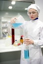 Woman working laboratory, glass cylinder vase Royalty Free Stock Photo