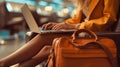 Woman working on laptop at airport, digital nomad Royalty Free Stock Photo