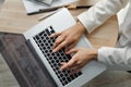 Woman working at laptop computer hands close up. Hand on keyboard close up.Closeup of a female hands busy typing on a laptop. Royalty Free Stock Photo