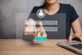 Woman working on laptop computer with login and password on screen display, cyber security concept Royalty Free Stock Photo