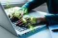 woman working on laptop computer with virtual graphic icon diagram