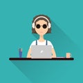 Woman working at a laptop with headphones sitting at her desk. Stock vector. Royalty Free Stock Photo