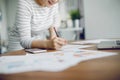 Woman working with laptop in living room