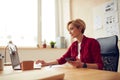 Woman Working Laptop At Office. Positive Lady Holding Mobile Royalty Free Stock Photo