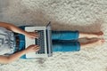 Woman  working on a laptop, online shoping, Payment. Female using a laptop sitting on floor,  searching web, browsing information, Royalty Free Stock Photo